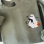 Left chest of a Military Green sweatshirt with an embroidered ghost hugging a black cat, a jack-o'-lantern pail, bats, a moon and stars