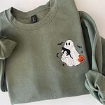 Military Green trick or treat ghost sweatshirt folded with rolled sleeves, showing the small embroidered ghost and black cat on the left chest