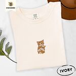 Ivory Comfort Colors T-shirt embroidered with two orange tabby kittens, one winking with a paw on the other's head