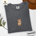 Pepper Comfort Colors T-shirt embroidered with two orange tabby kittens, one winking with a paw on the other's head