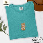 Seafoam Comfort Colors T-shirt embroidered with two orange tabby kittens, one winking with a paw on the other's head