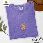 Violet Comfort Colors T-shirt embroidered with two orange tabby kittens, one winking with a paw on the other's head