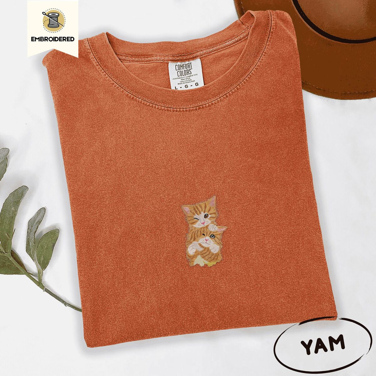 Two Kittens Shirt – Yam Yam Comfort Colors T-shirt embroidered with two orange tabby kittens, one winking with a paw on the other's head