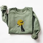 Military Green crewneck sweatshirt laid flat on a white background, embroidered with a black wolf silhouette howling at a yellow full moon with three bats