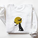 White crewneck sweatshirt laid flat on a white background, embroidered with a black wolf silhouette howling at a yellow full moon with three bats