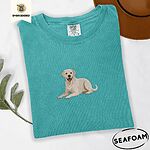 Seafoam Comfort Colors T-shirt embroidered with a smiling yellow Labrador lying down with its front paws stretched out