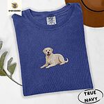 True Navy Comfort Colors T-shirt embroidered with a smiling yellow Labrador lying down with its front paws stretched out
