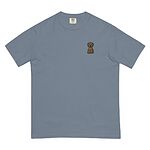 Blue Jean T-shirt on a white background, embroidered with a small golden cartoon Labrador puppy sitting with floppy ears on the left chest
