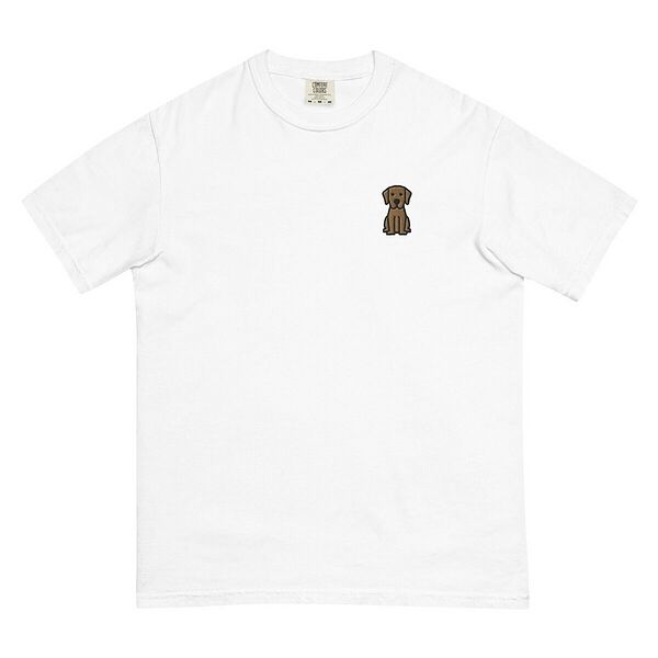 White T-shirt on a white background, embroidered with a small golden cartoon Labrador puppy sitting with floppy ears on the left chest