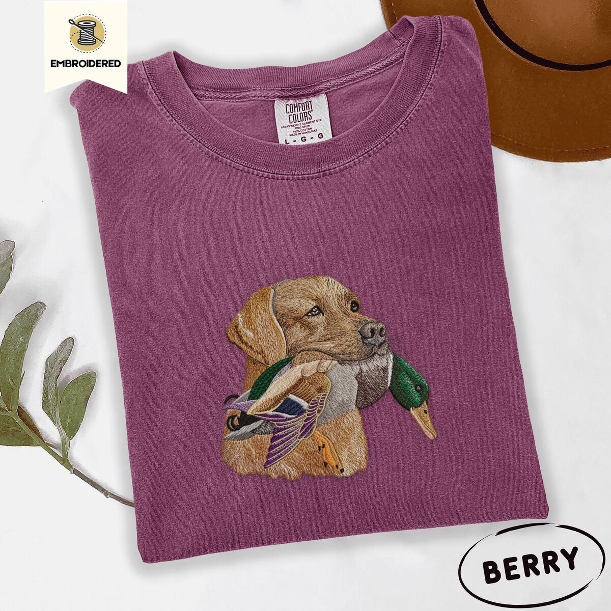 Yellow Lab Shirt – Berry Berry Comfort Colors T-shirt embroidered with a yellow Labrador head carrying a mallard drake in its mouth