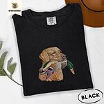 Black Comfort Colors T-shirt embroidered with a yellow Labrador head carrying a mallard drake in its mouth