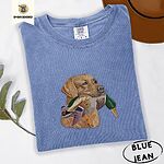 Blue Jean Comfort Colors T-shirt embroidered with a yellow Labrador head carrying a mallard drake in its mouth