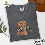 Pepper Comfort Colors T-shirt embroidered with a yellow Labrador head carrying a mallard drake in its mouth