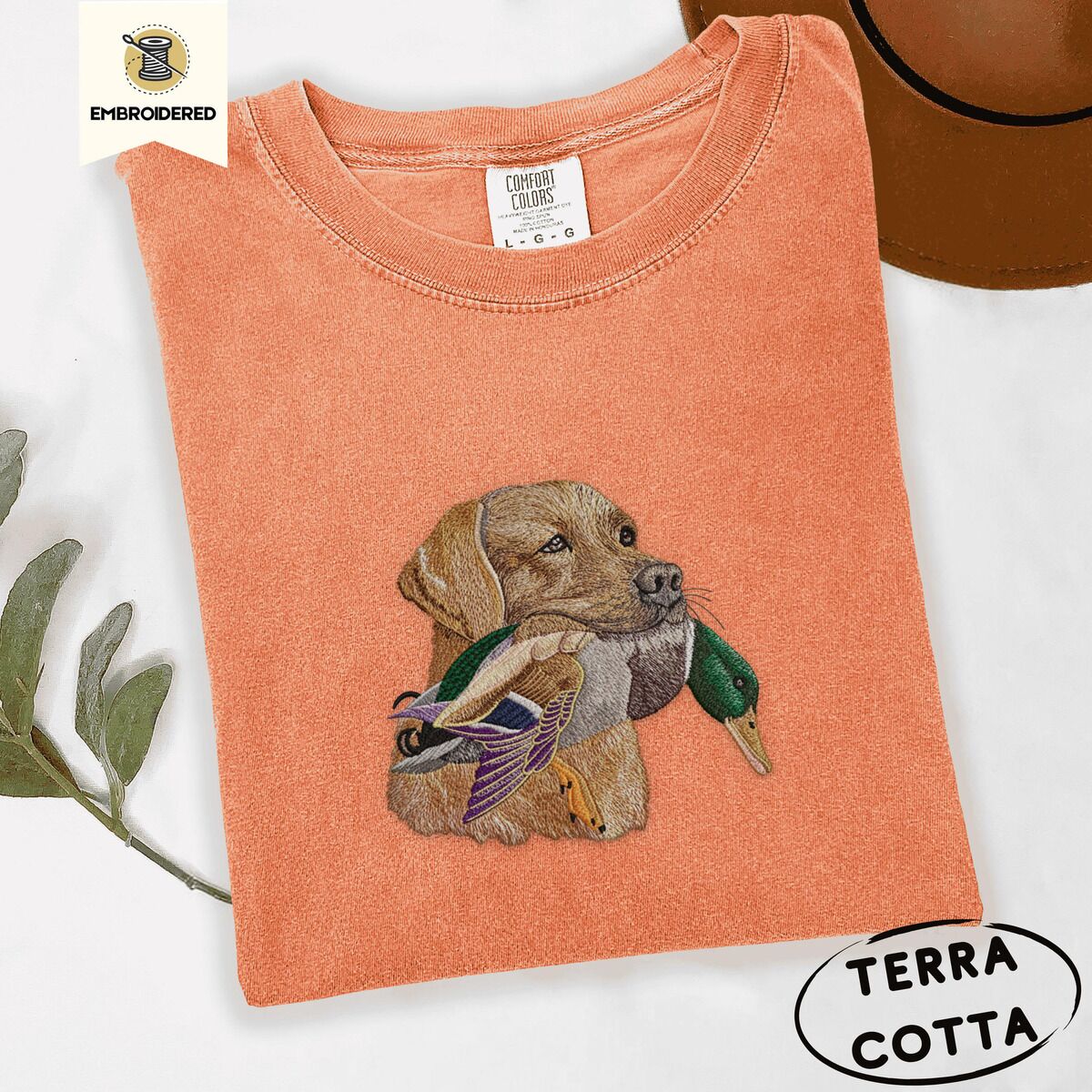 Yellow Lab Shirt – Terracotta Terracotta Comfort Colors T-shirt embroidered with a yellow Labrador head carrying a mallard drake in its mouth