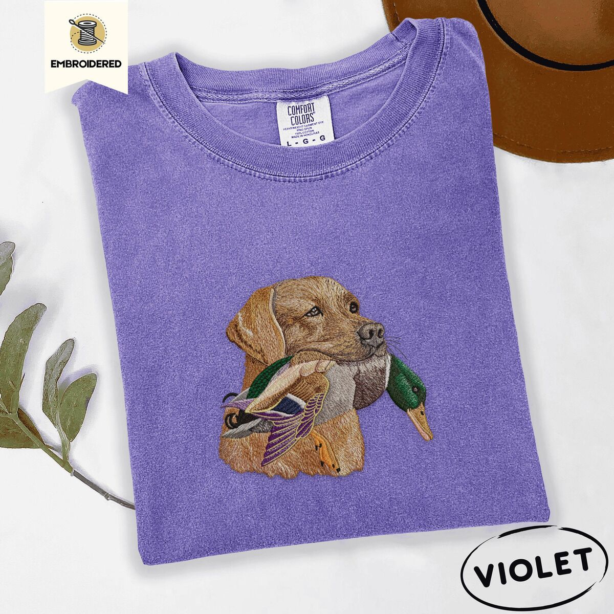 Yellow Lab Shirt – Violet Violet Comfort Colors T-shirt embroidered with a yellow Labrador head carrying a mallard drake in its mouth