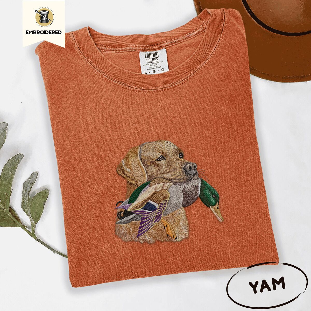 Yellow Lab Shirt – Yam Yam Comfort Colors T-shirt embroidered with a yellow Labrador head carrying a mallard drake in its mouth