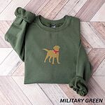 Military Green crewneck sweatshirt laid flat on herringbone wood, embroidered with a golden yellow Labrador silhouette standing in a pink collar and round tag in the center of the chest