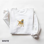 White crewneck sweatshirt laid flat on white, embroidered with a golden yellow Labrador silhouette standing in a blue collar and round tag in the center of the chest