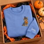Yorkie Halloween sweatshirt folded in a gift box with mini pumpkins